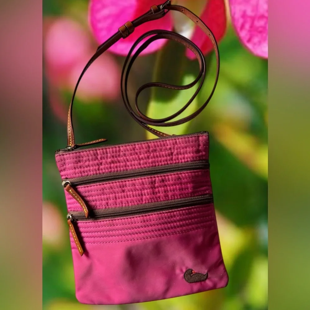 Dooney & Bourke Nylon North South Triple Zip Crossbody in Fuchsia